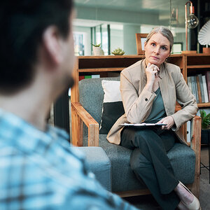 A female mental health provider listens to a patient A female mental health provider listens to a patient