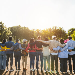 A line of people embracing. A line of people embracing.