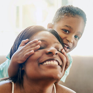 A mother and child playing.