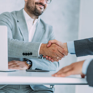 Two people closing a loan agreement.