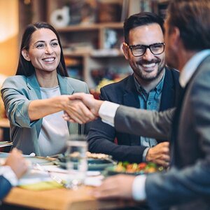 Two people making a business deal.