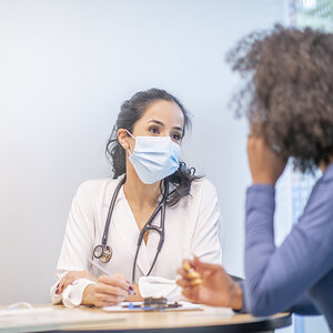 A doctor and patient in a meeting.