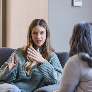 A woman in a therapy session. A woman in a therapy session.