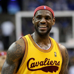 A smiling basketball player looks to his right – an image of LeBron James.