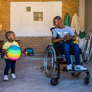 Two children play after a wheelchair fitting at Shonaquip Social Enterprises in Cape Town, South Africa. Two children play after a wheelchair fitting at Shonaquip Social Enterprises in Cape Town, South Africa.