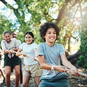 Children at summer camp playing tug of war. Children at summer camp playing tug of war.