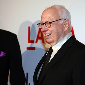 An older man in a suit wearing glasses - an image of Ellsworth Kelly.