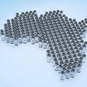 Vaccine vials arranged in the shape of the continent of Africa.