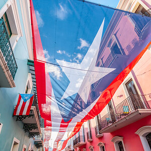 The Puerto Rican flag hanging over a street in Viejo San Juan. The Puerto Rican flag hanging over a street in Viejo San Juan.