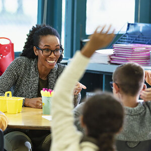 A teacher answering a student's questions. A teacher answering a student's questions.