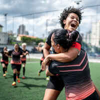 A women's soccer team celebrating a win. A women's soccer team celebrating a win.