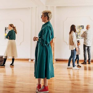 A woman in an art gallery. A woman in an art gallery.