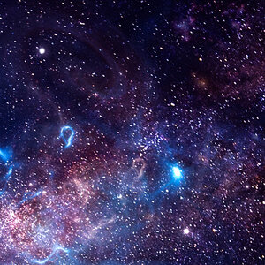 An image of stars and galaxies as seen through a telescope.