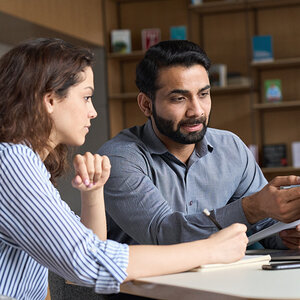 Two people working together. Two people working together.