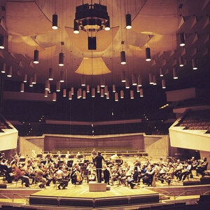 An orchestra performing on stage. An orchestra performing on stage.