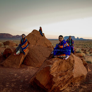 Indigenous people sitting in the desert. Indigenous people sitting in the desert.