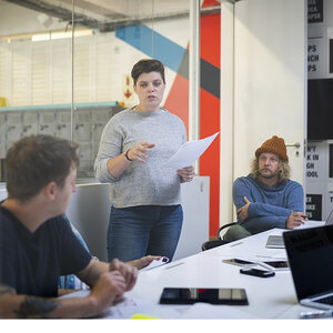 An editorial meeting in a newsroom. An editorial meeting in a newsroom.