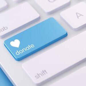 A bule "donate" button on a keyboard.