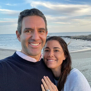 A husband and wife pose for a selfie on the beach – a photo of David Velez and Mariel Reyes. A husband and wife pose for a selfie on the beach – a photo of David Velez and Mariel Reyes.