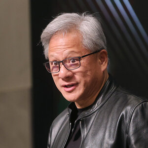 A man with gray hair and glasses wearing a leather jacket – a photo of Jensen Huang. A man with gray hair and glasses wearing a leather jacket – a photo of Jensen Huang.