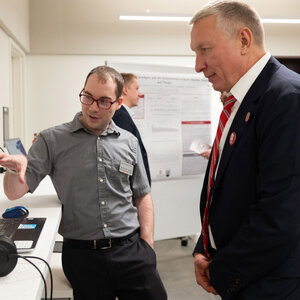 Jeremy W. Smith talks with Ratmir Timashev at Timashev Family Music building dedication October 23, 2022.