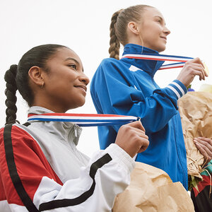 Olympic athletes posing with their medals.