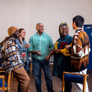 People gathered at a community center. People gathered at a community center.