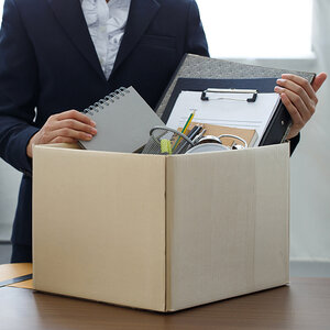 A terminated employee clearing out their desk.