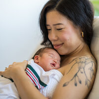 A mother and a newborn. A mother and a newborn.