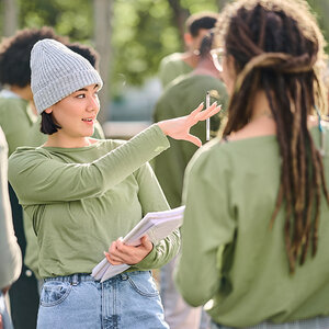 Volunteers working together outside. Volunteers working together outside.