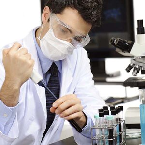 A cancer researcher working. A cancer researcher working.