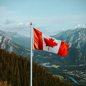 The Canadian flag blowing in the wind.