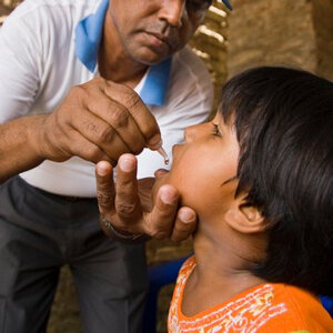 A child receives an oral polio vaccination.