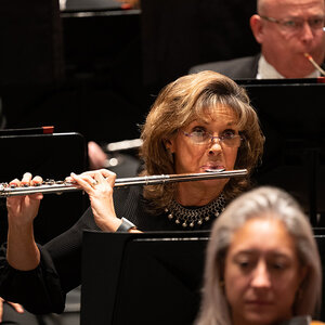 A woman playing the flute with the Sarasota Orchestra. A woman playing the flute with the Sarasota Orchestra.