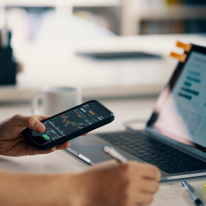 A person tracking their banking behavior. A person tracking their banking behavior.
