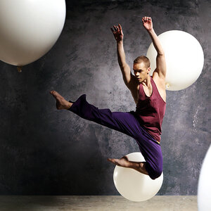 A modern dancer leaps into the air.