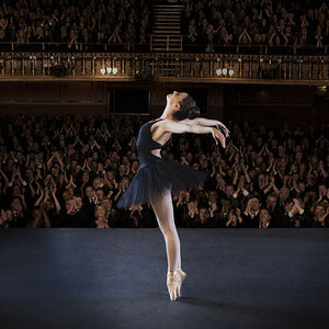 A ballet dancer performing on stage. A ballet dancer performing on stage.