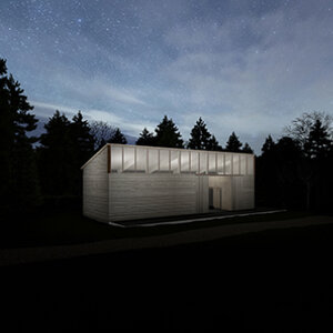 An artist studio at night illuminated from within and surrounded by trees and dark sky. An artist studio at night illuminated from within and surrounded by trees and dark sky.