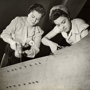 Women working on World War II aircraft assembly.