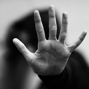 A child with their hand extended. A child with their hand extended.