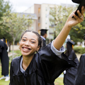 A girl celebrating her graduation. A girl celebrating her graduation.