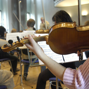 Students in a music class practicing. Students in a music class practicing.