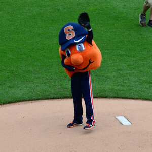 Syracuse University mascot standing on a pitcher's mound. Syracuse University mascot standing on a pitcher's mound.
