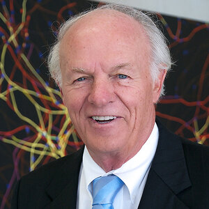 An older man with gray hair wearing a dark suit with a light blue tie - a photo of T. Denny Sanford