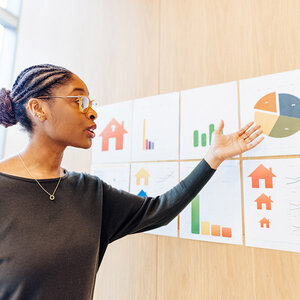 a woman teaching a financial literacy class.