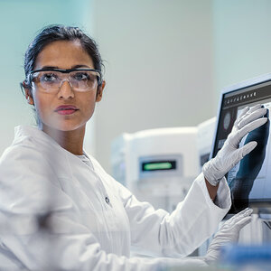A female scientist is working in a laboratory. A female scientist is working in a laboratory.