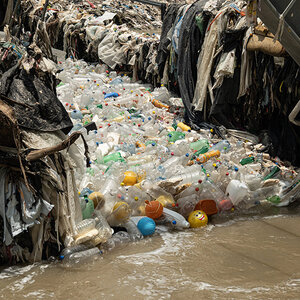 Accumulated trash in a river. Accumulated trash in a river.