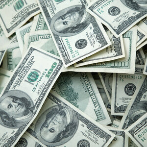 A large pile of one-hundred-dollar bills.