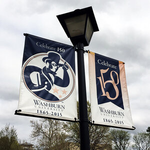 A lamppost hung with banners that read: Washburn 1865-2015. A lamppost hung with banners that read: Washburn 1865-2015.