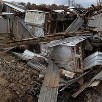 An image of upturned trucks and damaged buildings in the aftermath of Hurricane Helene. An image of upturned trucks and damaged buildings in the aftermath of Hurricane Helene.